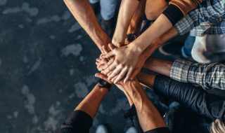 Hands held in a circle